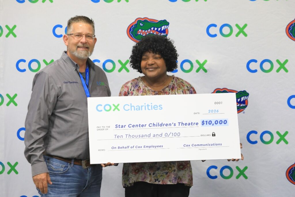 David Terrell (left) with Cox Communications presented a second check to Star Center Children's Theatre after the organization earned one in 2025. Photo by Seth Johnson