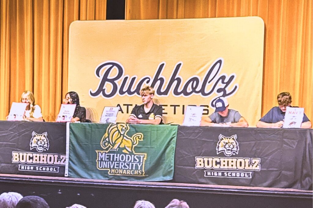 (From left) Buchholz's Becca Beyer, Bella Velarde, Teague McNeal, Sam Freas and Davis Garrett signed to play at the collegiate level on Wednesday. Photo by Marty Pallman