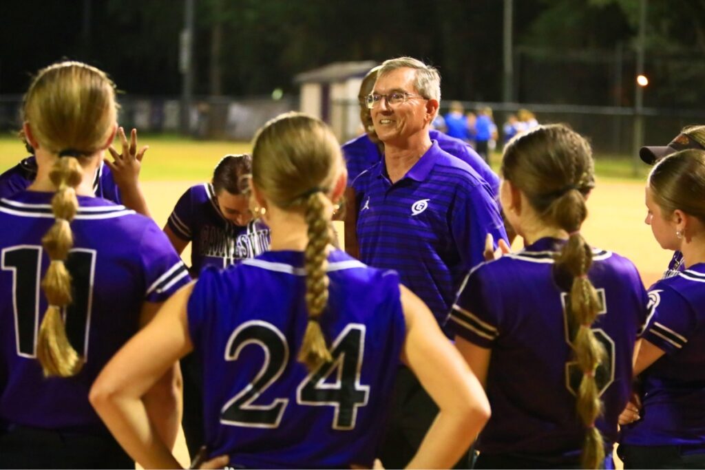 Gainesville coach Chris Chronister all smiles after the Hurricanes rallied to win their third straight district title in a 7-6 win over Deltona. Photo by C.J. Gish