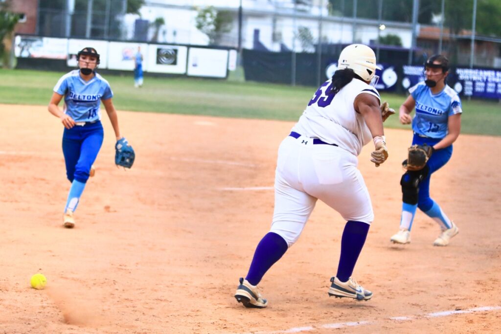 Gainesville's Brooke Parker (55) lays down a bunt and gets to first base safely in the fourth inning against Deltona in the Class 5A-Region 2 Quarterfinal. Photo by C.J. Gish