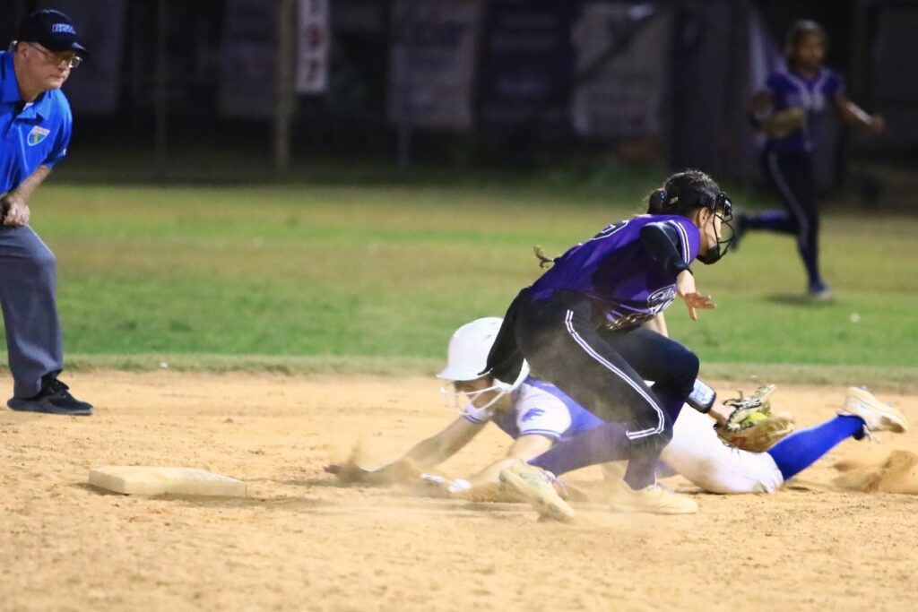 Gainesville's Lana Renicks (15) barely misses a tag out in the seventh inning against Deltona in the 5A-District 5 championship game. Photo by C.J. Gish