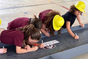 Oak Hall School marks ‘Two Spaces. One Vision’ milestone with beam signing