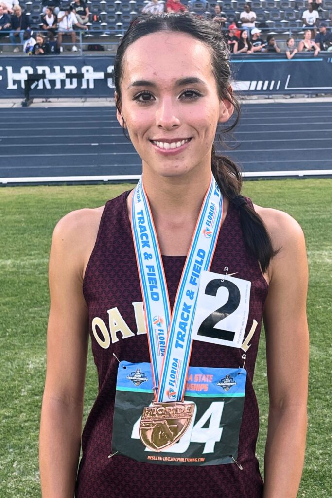 Oak Hall senior Estella Collante finished third in both the 800- and 1600-meter runs. Photo by Mike Ridaught
