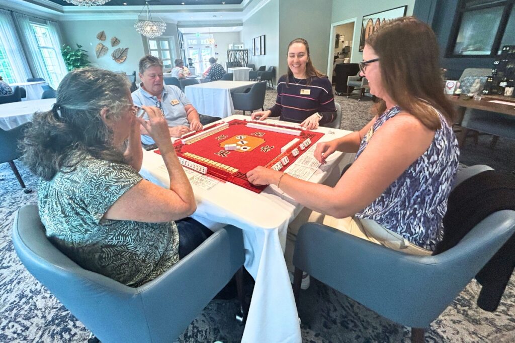 One of the tables of players at the first Gainesville Mahjong Rack Pack event at the Village. Photo by Ronnie Lovler