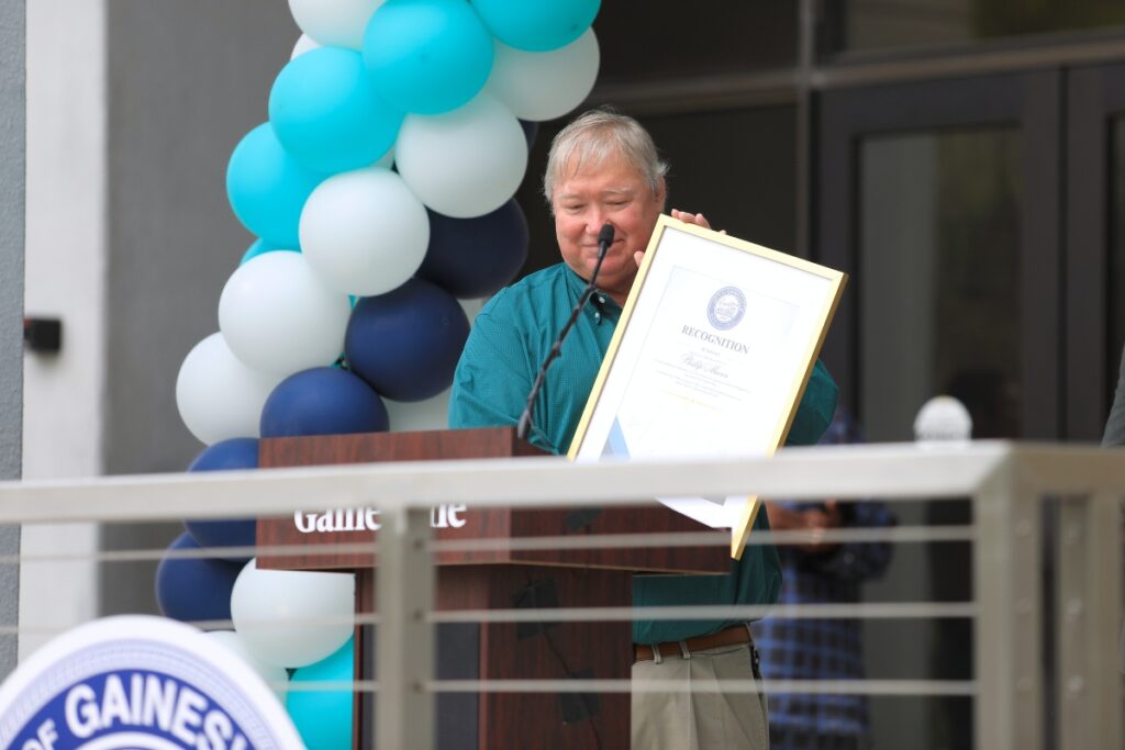 Phil Mann receives a recognition for his work on the City Hall Plaza project. Photo by Seth Johnson
