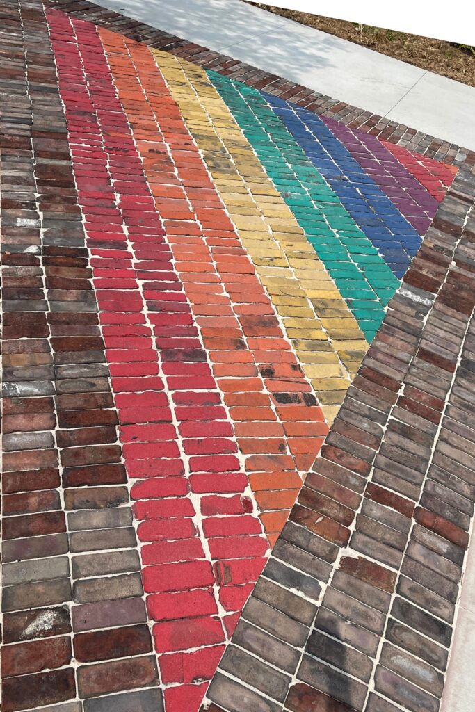 Rainbow crosswalk bricks were reused in a triangle at City Hall Plaza. Photo by Seth Johnson