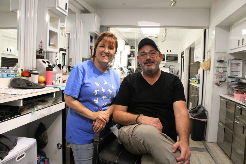 Rita Parillo (left) and Anthony Brooks set up a hair and makeup studio for filming in Micanopy. Photo by Lillian Hamman