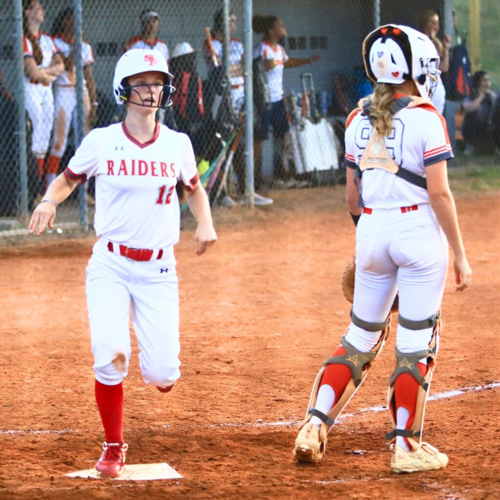Santa Fe's Catie Bell (12) scores in the fifth inning for a 3-0 lead against Mount Dora in the Class 3A-Region 2 Quarterfinals. Photo by C.J. Gish