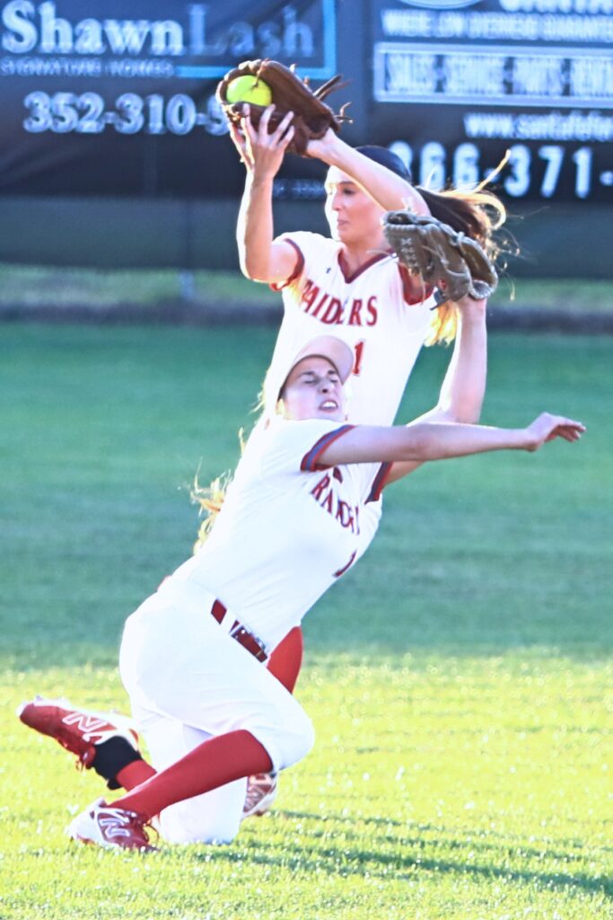 Santa Fe's Maren Hornsby (1) snags the second out in front of Chloe Cason (15) in the fourth inning against Mount Dora in the Class 3A-Region 2 Quarterfinals. Photo by C.J. Gish
