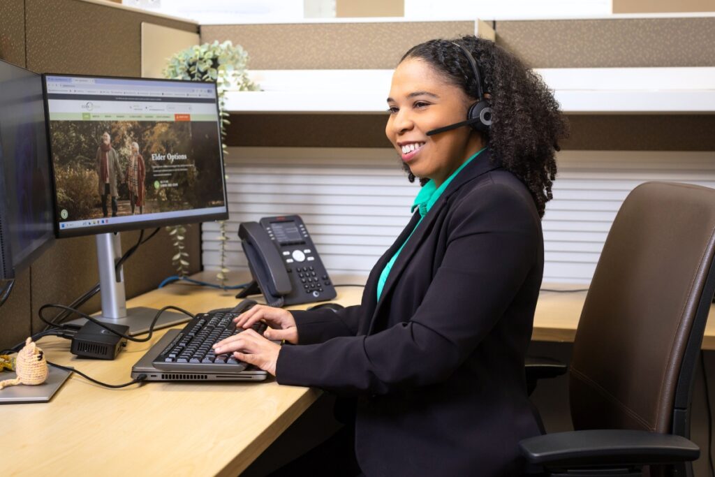 Sarah, an Elder Options Helpline counselor, takes a call. Courtesy of Elder Options