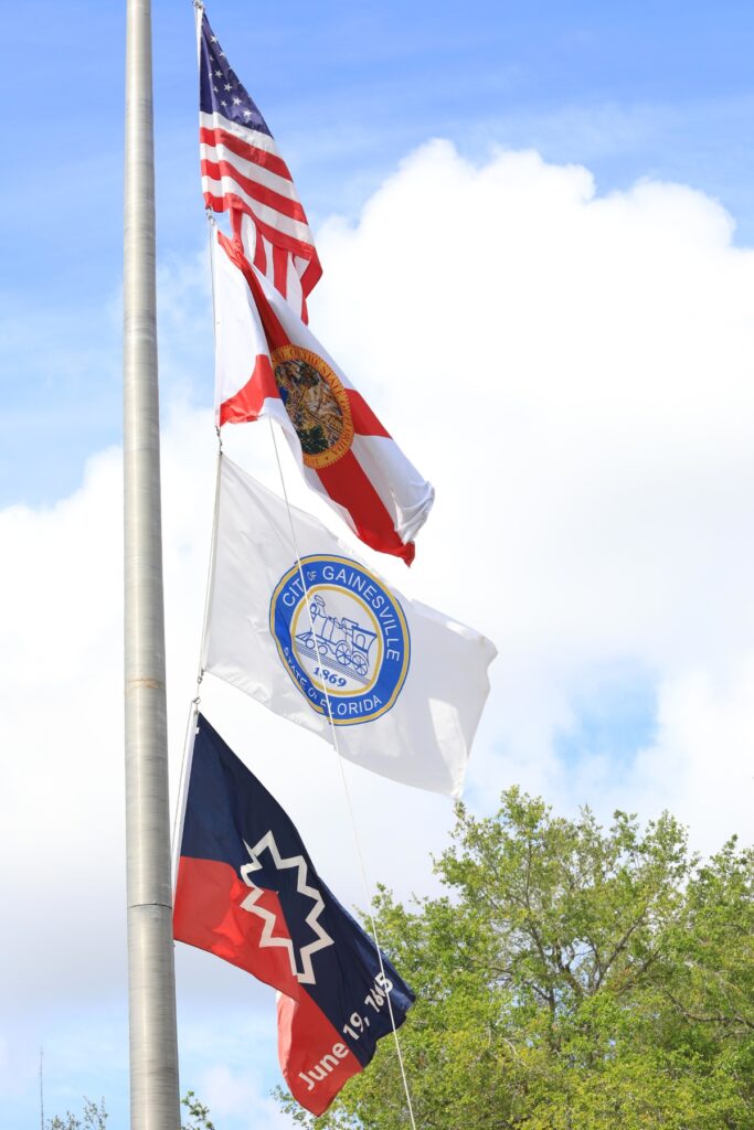 The city of Gainesville added the Juneteenth flag below the flags of the United States of America, the state of Florida and the city of Gainesville. Photo by Seth Johnson