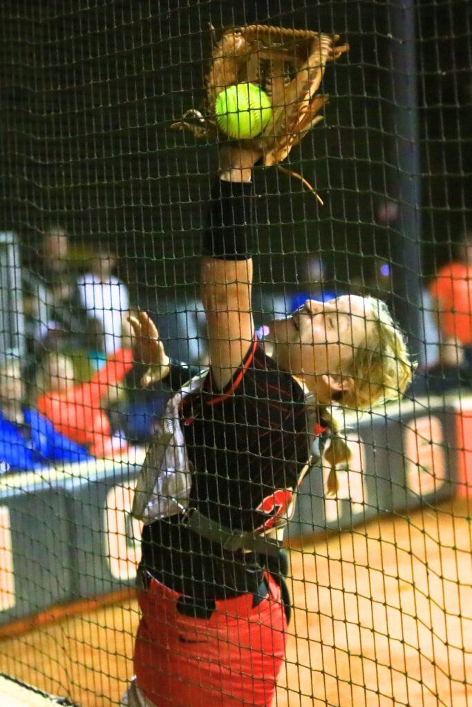 Trenton catcher Khloe Kirby attempts to catch a foul ball in the top of the seventh inning against Williston in the Rural-Region 4 Final. Photo by C.J. Gish