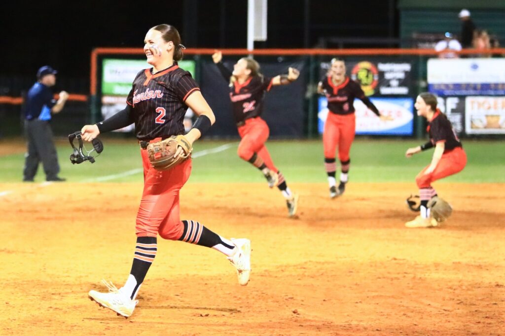 Trenton's Addison Allaire (2) is all smiles after striking out the final batter in a 2-1 win against Williston in the Rural-Region 4 Final. Photo by C.J. Gish