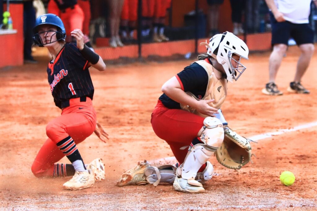 Trenton's Emily Winfield (1) slides safely into home for a 1-0 fourth inning lead against Williston in the Rural-Region 4 Final. Photo by C.J. Gish