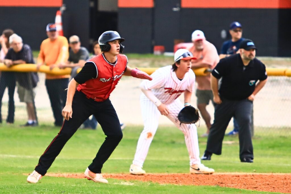 Williston's Aiden Phillips (39) gets a lead off first base in the top of the first inning against Trenton in the first game of the Rural-Region 4 Finals. Photo by C.J. Gish