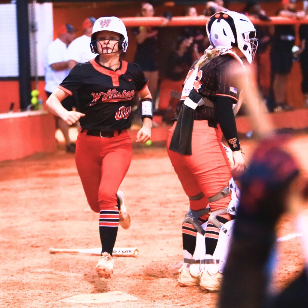 Williston's Dixie Adams (00) ties the game 1-1 in the top of the fifth inning against Trenton in the Rural-Region 4 Final. Photo by C.J. Gish