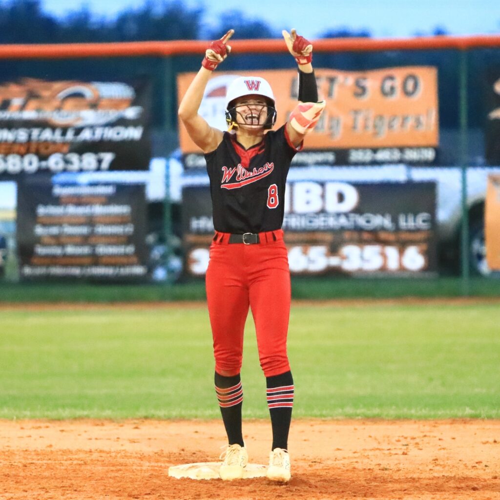 Williston's Luna Acencion (8) hits a double in the top of the fifth inning against Trenton in the Rural-Region 4 Final. Photo by C.J. Gish