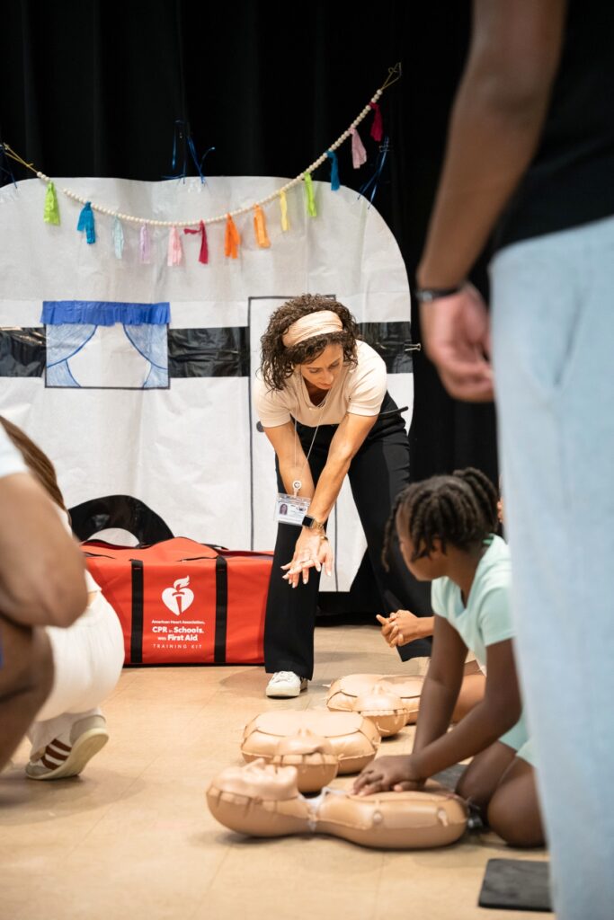 ACPS Health Services Supervisor Johnelly Green instructing students on proper technique to use during when administering CPR. Photo by Tim Rodriquez