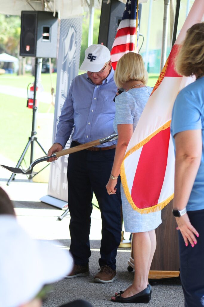 Alan Hitchcock is presented with a ceremonial shovel. Photo by Lisa Brosky - Santa Fe College