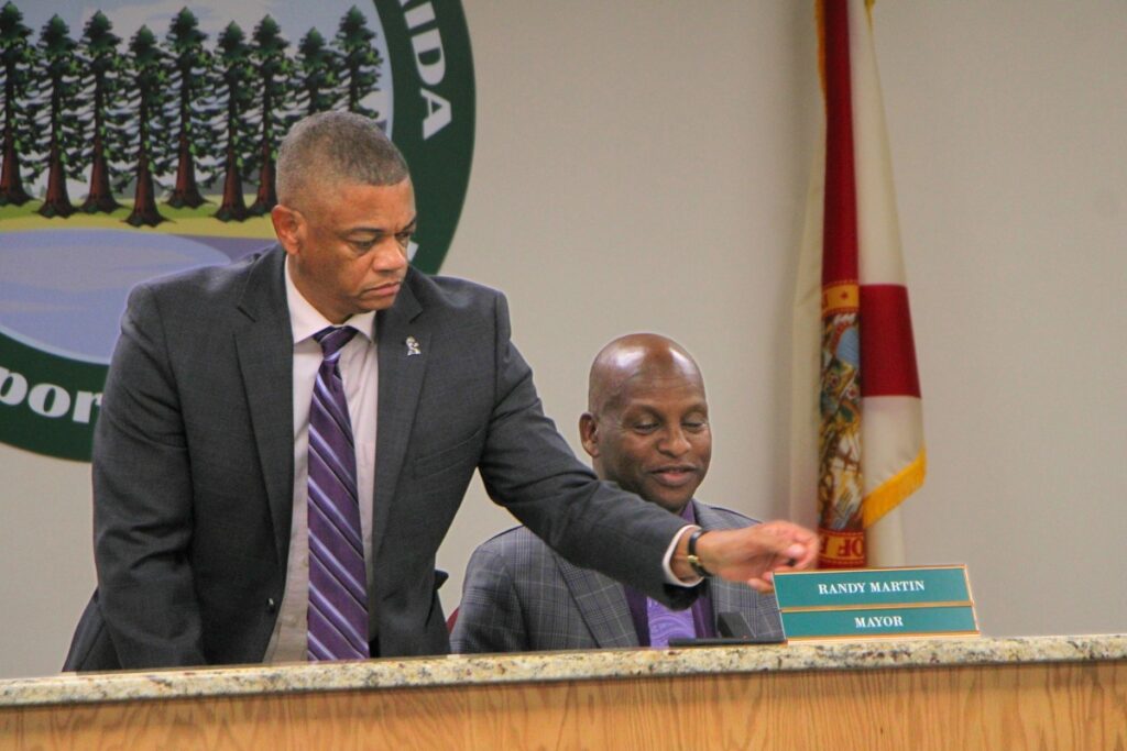 Commissioner Randy Martin (sitting) is elected mayor of Hawthorne. 