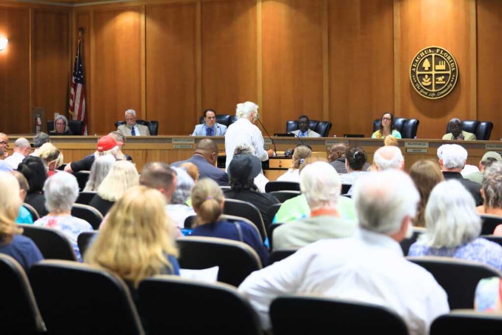 Community members packed Alachua City Hall on Monday to oppose and support the Farmlands Commercial land use change. Photo by Lillian Hamman
