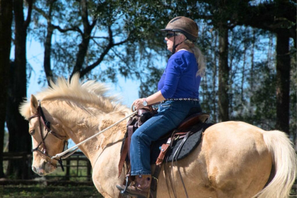 Jamie Menzer riding her horse. Courtesy of Jamie Menzer