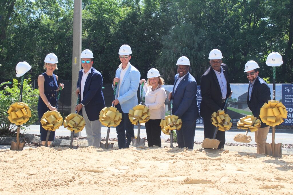 Members of the Santa Fe College District Board of Trustees and President Paul Broadie II take part in the ceremonial groundbreaking for the automotive technology training center at the Blount Center campus in downtown Gainesville.