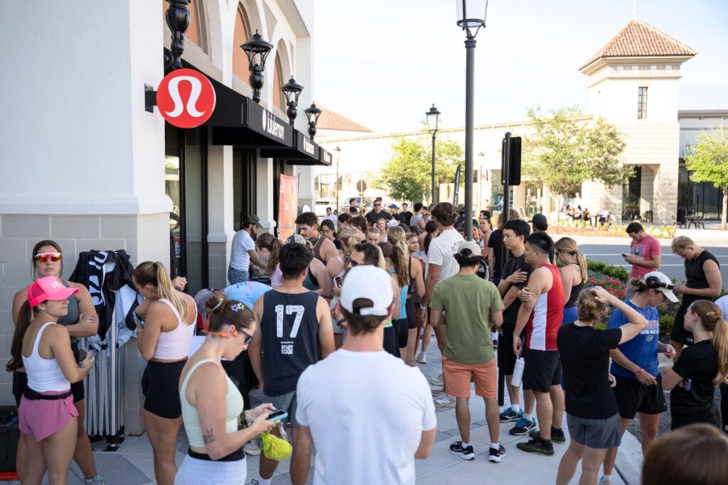 Runners gather outside of lululemon in Butler Plaza before the Global Running Day event begins. Photo by Tim Rodriquez