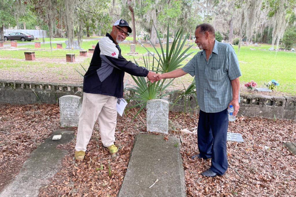 Thomas and Jack Carter meet on Memorial Day at the graves of their father, mother, and brothers Vernon and John. Photo by Seth Johnson