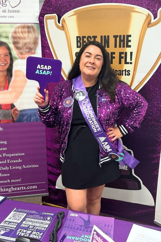 Touching Hearts at Home Executive Director Christina Ramos strikes a pose with her sparkling jacket that she dons to make her campaign to get legislation approved to aid in the early diagnosis of Alzheimer’s Disease.