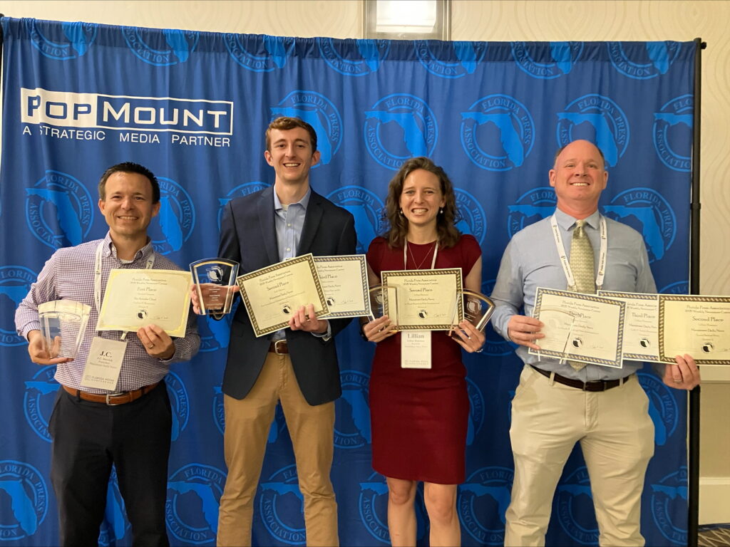 L-R: J.C. Derrick, Seth Johnson, Lillian Hamman and C.J. Gish display awards won Friday at the Florida Media Conference in Orlando.