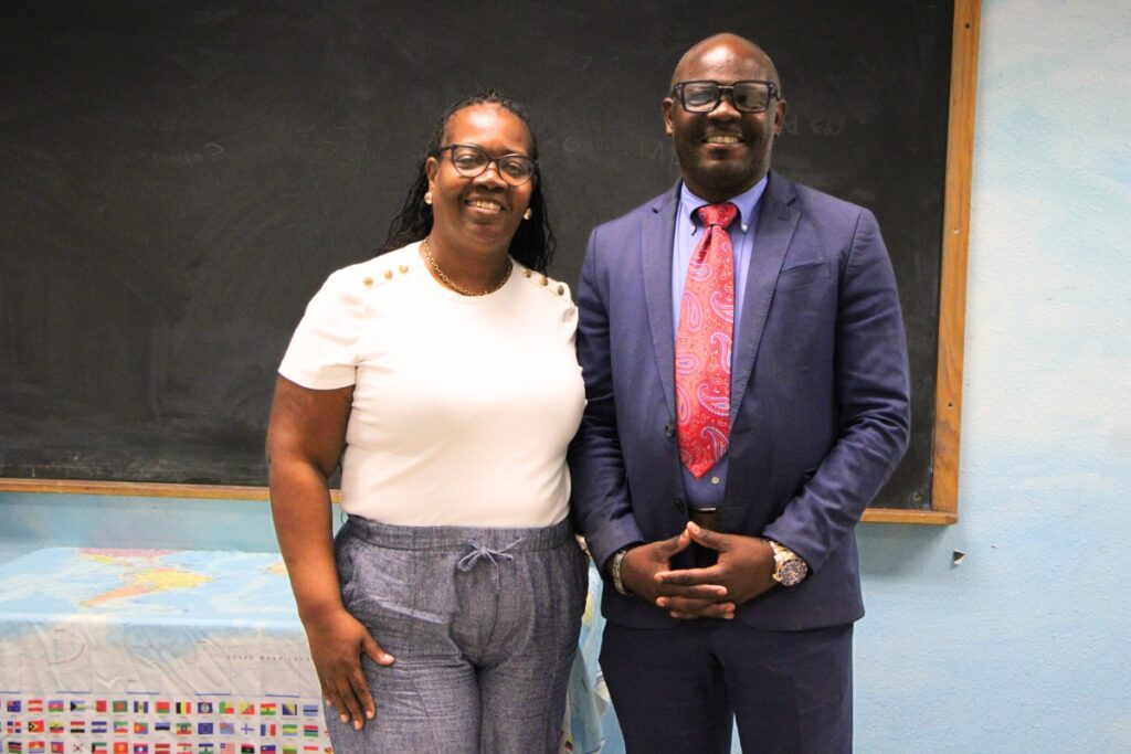 Cynthia Walker and Christopher Graham prep classrooms for school.