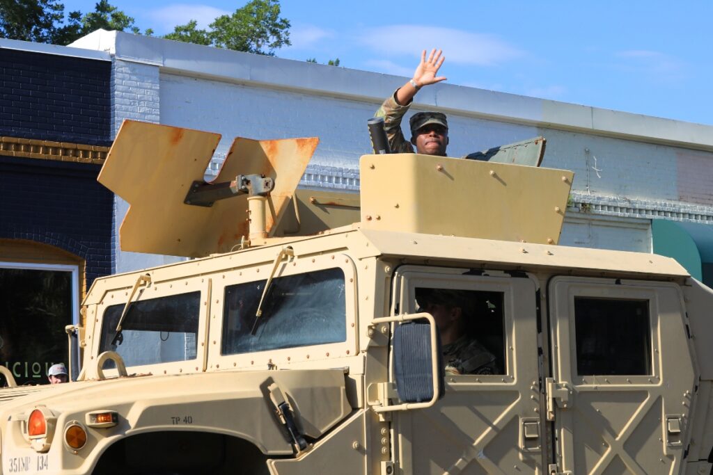 A Humvee rumbles down the center of downtown Newberry. 