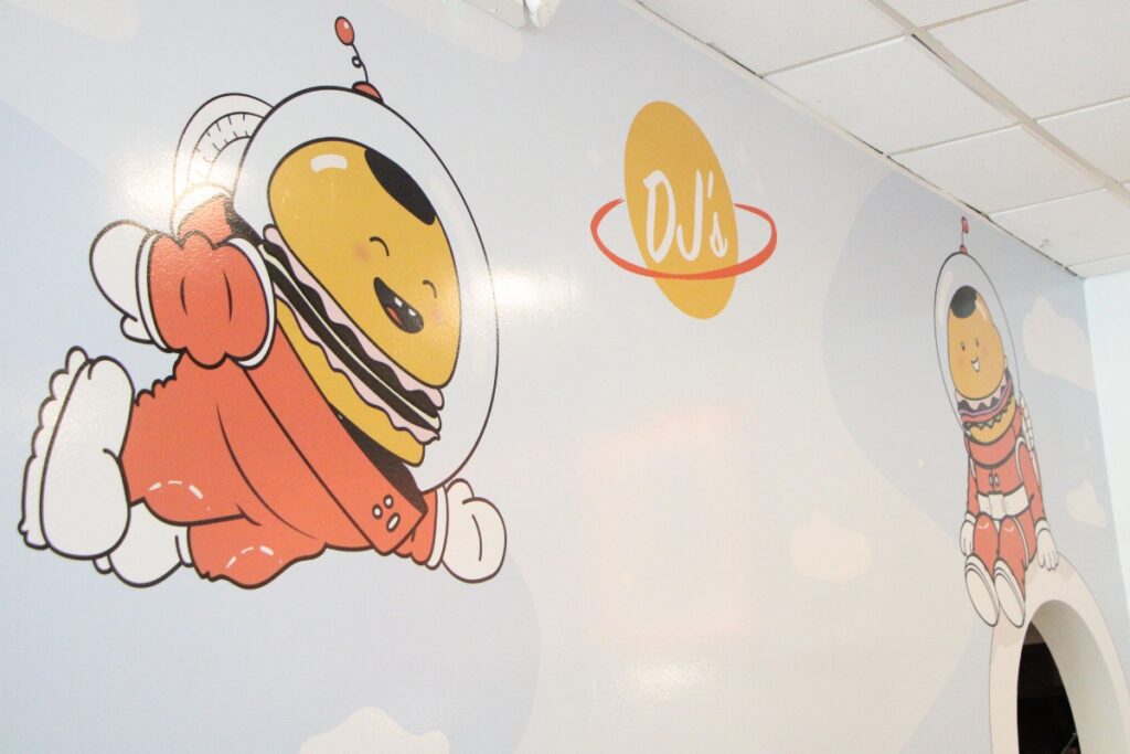 A mural inside DJ's storefront.