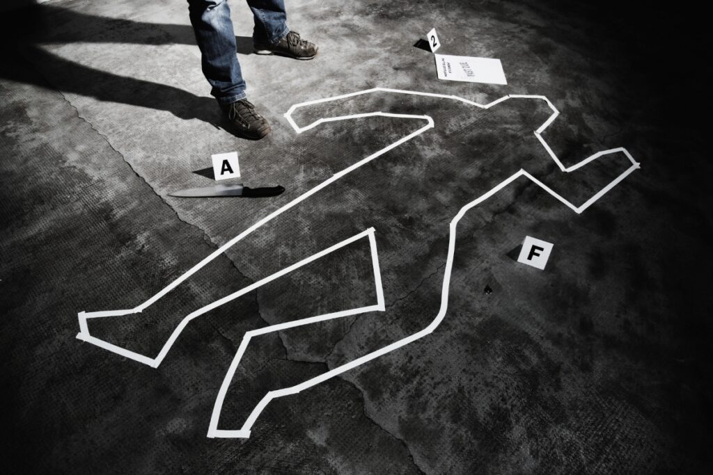 Body chalk outline at crime scene. Metro Creative