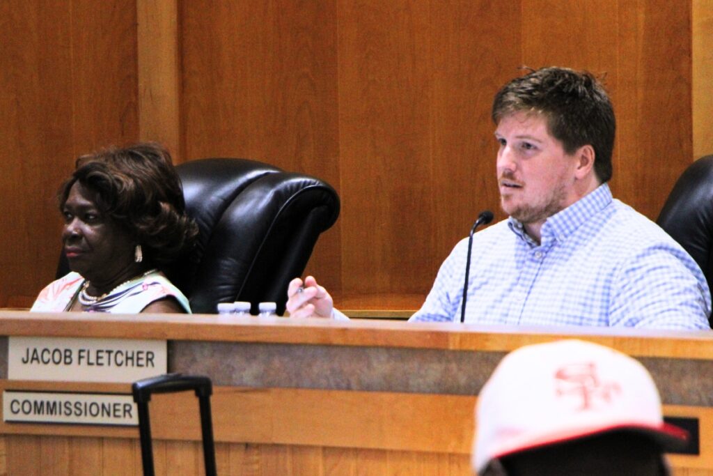 Commissioner Jacob Fletcher (right) questioned whether Farmlands Commercial should have one or two hearings for land use changes. Photo by Lillian Hamman