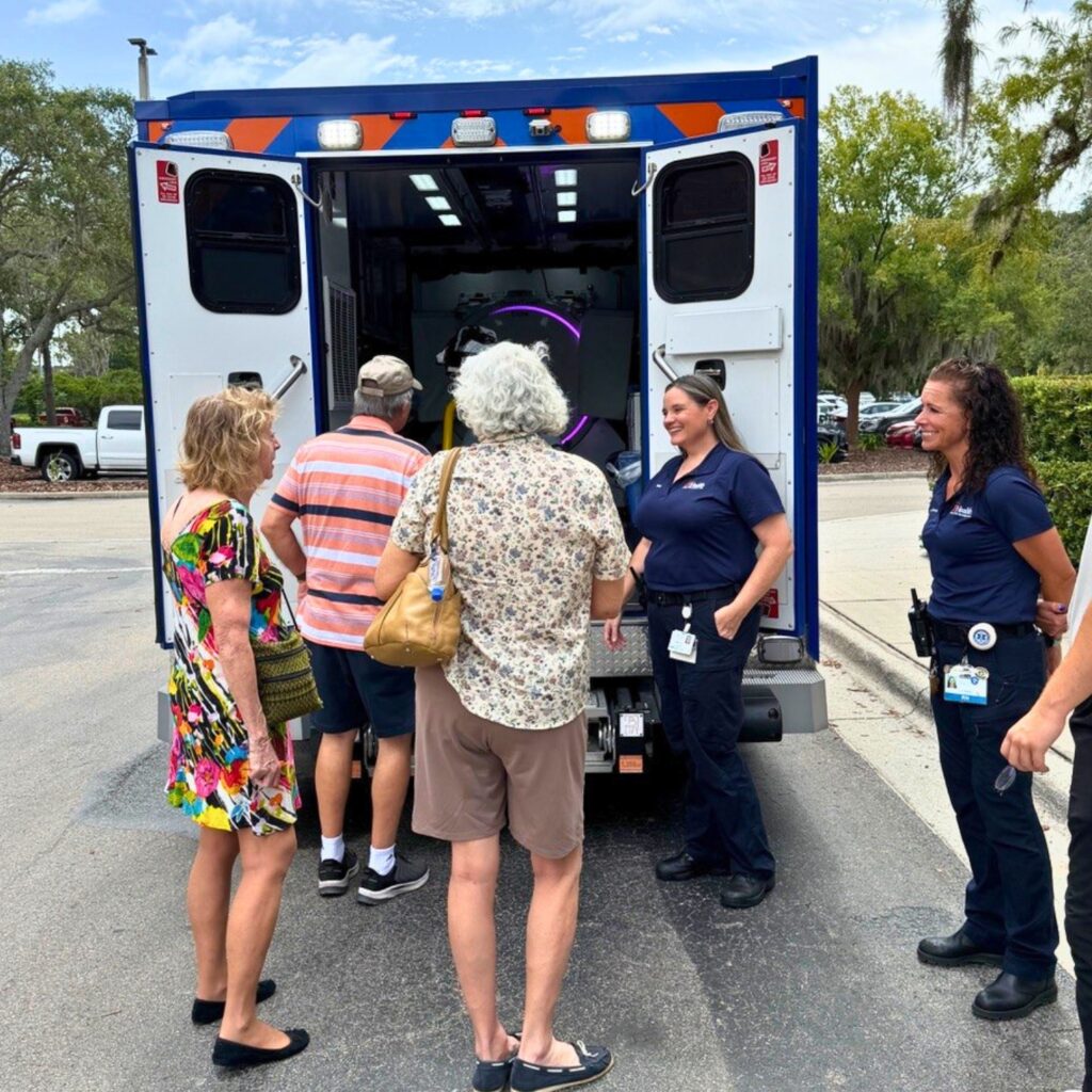 Members of UF Health’s Mobile Stroke Treatment Unit meet with community members at a recent event. Photo by UF Health