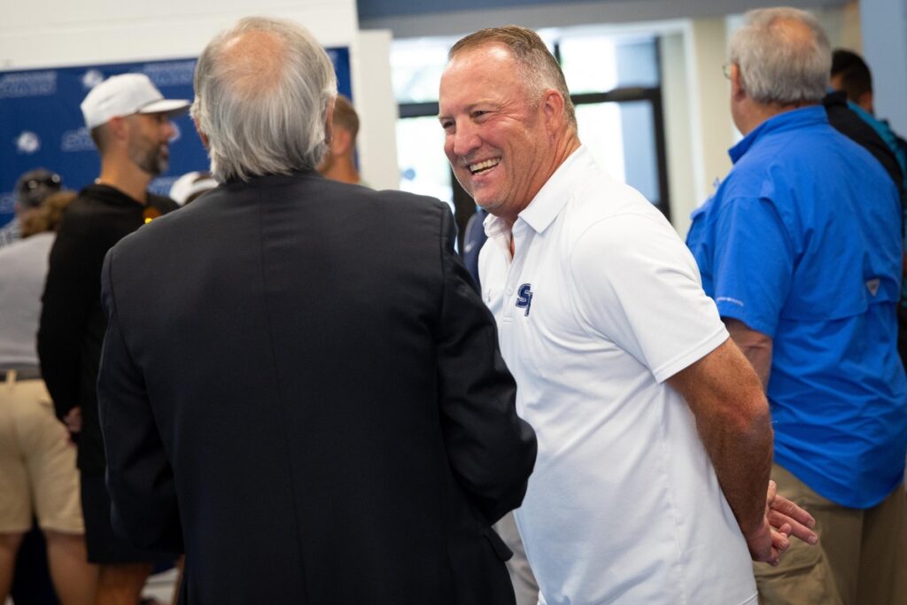 Santa Fe College head baseball coach Johnny Wiggs during his retirement celebration at the Santa Fe College Gymnasium lobby on Wednesday. Photo by Matt Stamey-Santa Fe College