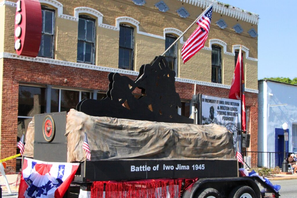 The Milton Lewis Young Marines recreated the iconic raising of a flag over Iwo Jima as their float. 