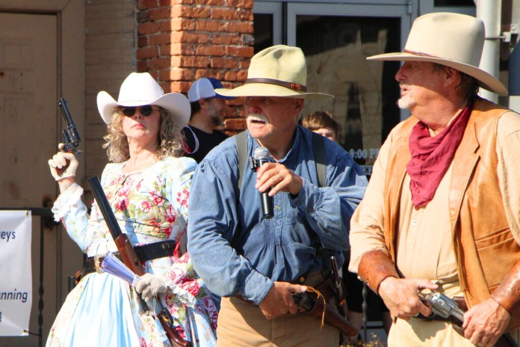 The Shadow Riders engaged in a western dual along Newberry Road during the parade. 