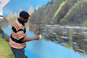 Gainesville to restore public art mural by Florida Highwaymen artist Al Black