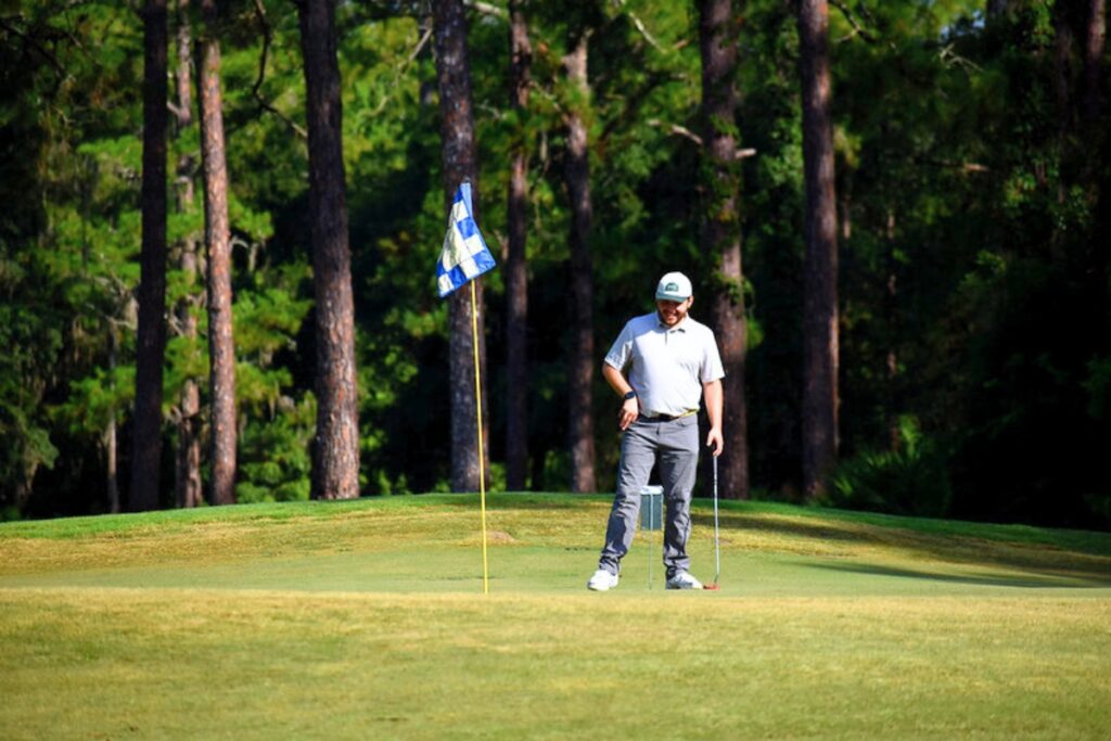 A golfer considers his putt at GRU's annual benefit tournament. Courtesy GRU