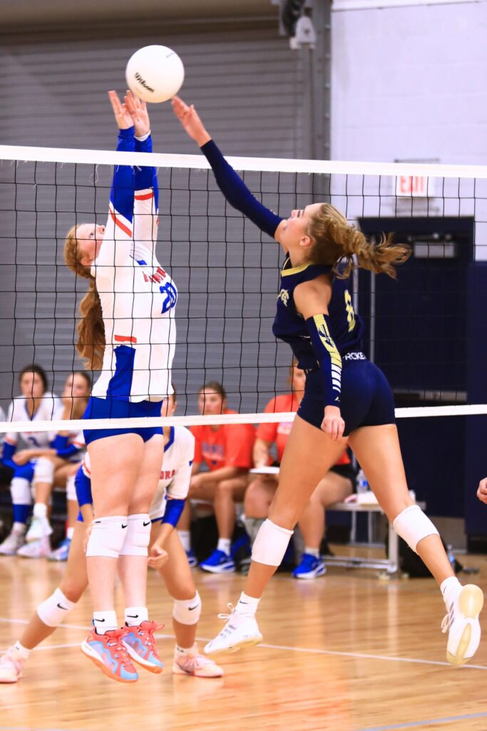 Branford's Calyssa Dicks (20) with a block attempt against Aucilla Christian at the Crafty Gemini Preseason Showdown on Thursday. Photo by C.J. Gish
