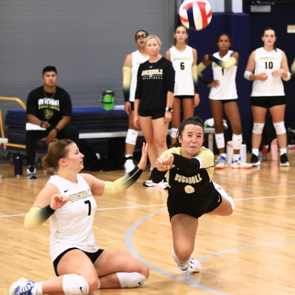 Buchholz's Izzy Carter (8) with a dig against Santa Fe at the Crafty Gemini Preseason Showdown on Thursday. Photo by C.J. Gish