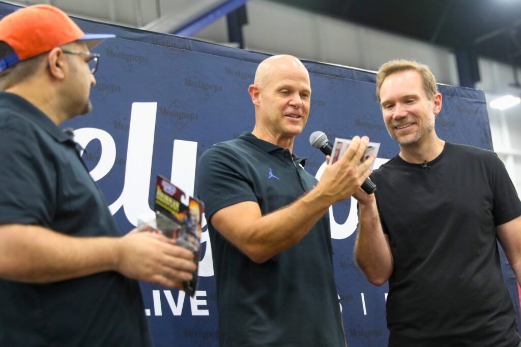 Former Florida quarterback Danny Wuerffel, center, speaks with fans and accepts memorabilia during the Florida Legends event at the Alachua County Sports & Events Center on Sunday.