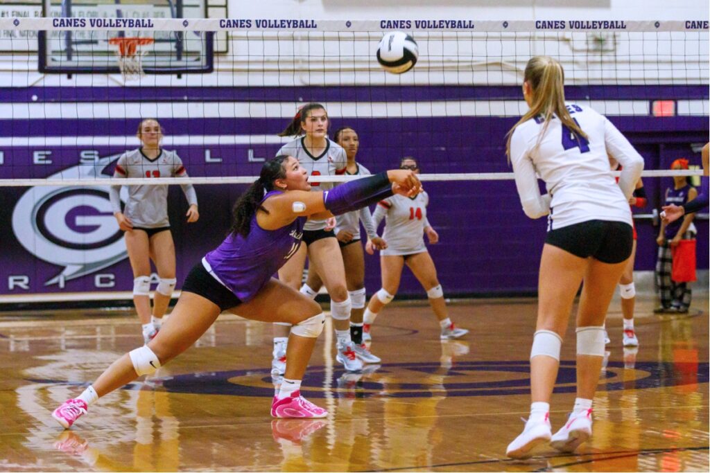 Gainesville's Kenzie Carter-Mitchell (11) with a dig against Santa Fe on Tuesday. Photo by Walker Smith