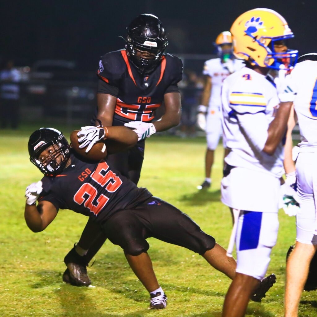 Hawthorne's Derryek Gillins (25) plunges into the end zone for a third-quarter touchdown against Newberry on Friday. Photo by C.J. Gish