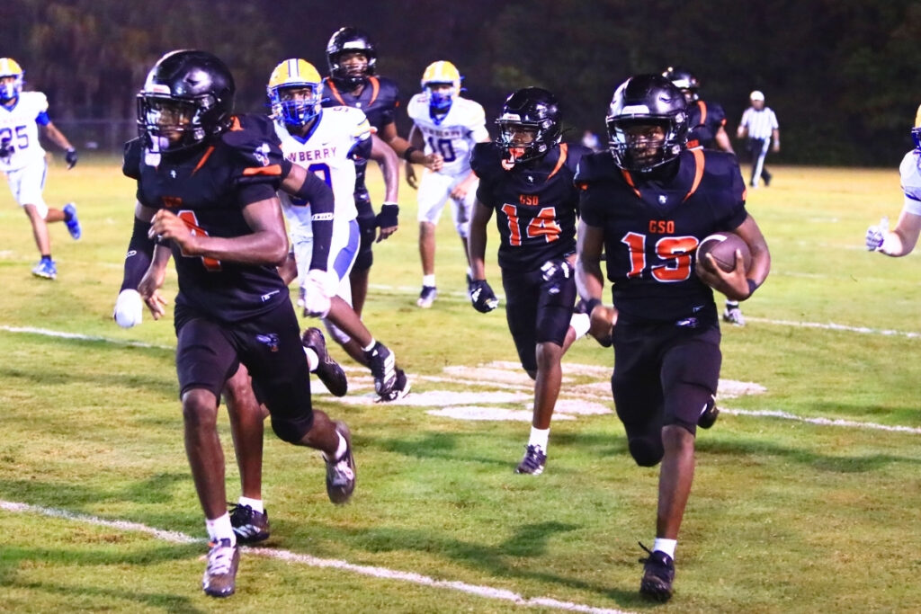 Hawthorne's Leveon Harris (19) returns a safety kick to Newberry's 9-yard line on Friday. Photo by C.J. Gish