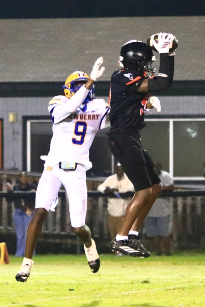 Hawthorne's Maverick Jones with a second-quarter interception against Newberry on Friday. Photo by C.J. Gish