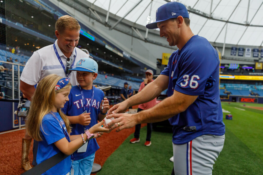 Langford signs autographs for young fans before a game against the Tampa Bay Rays on July 28 at Tropicana Field.
